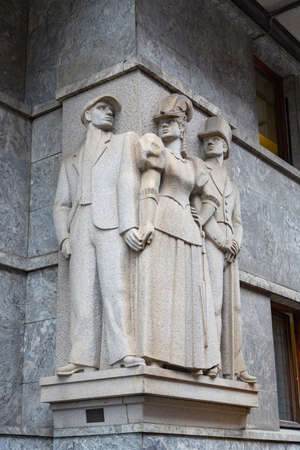 Oslo, Norway - July, 2016: Monument of Pimp, prostitute and client on City Hall. Built in old red light area, Oslo, Norway.のeditorial素材