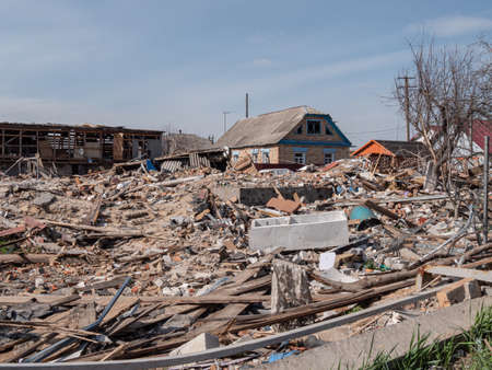 Destroyed houses after rocket and air strikes. Bombed houses of civilians. War in Ukraine 2022.