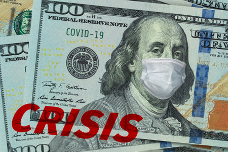 Medical mask on a banknote of 100 dollars, concept of the global financial crisis. Medical mask or surgical mask on american money.の写真素材