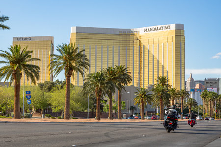 Las Vegas, Nevada - April 2017: Mandalay Bay. Entering Las Vegas, Mandalay Bay is the first hotel on the main boulevard of the city. Golden facade of Mandalay Bay sparkles in the rays of the sun.のeditorial素材