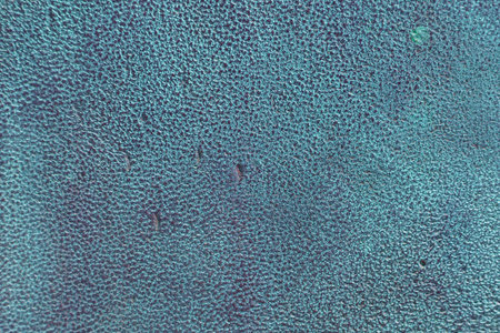 Background is a bronze plate covered with oxide green patina, the surface is rough with scratches and gouges. Rough Bronze Texture with Patina. Oxidized Bronze Covered By Rust And Corrosion.の写真素材