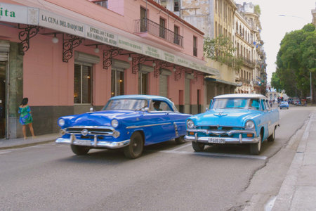 Havana, Cuba - JAN 10, 2022 - Centro Habana, classic 1950's American cars. Havana center with vintage car. Colorful Classic 1950's American Vintage Cuban Cars driving on street old Havana. Cuba travelのeditorial素材