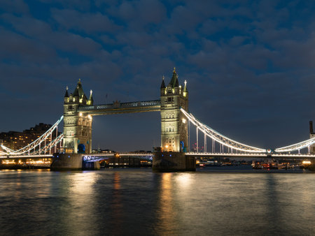 Tower Bridge at night illuminated by floodlights. Famous Tower Bridge in the evening, London, England. Night cityscape with Tower Bridge, London, UK. Tower Bridge with reflections in Thames at sunset.の写真素材