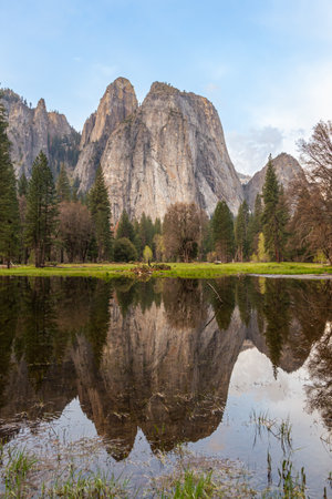 Middle Cathedral Rock reflecting in Merced River at Yosemite National Park. California. Waterfalls and Mountains of Yosemite Valley, California USA. Mirror Lake full after snow melt in the spring.の写真素材