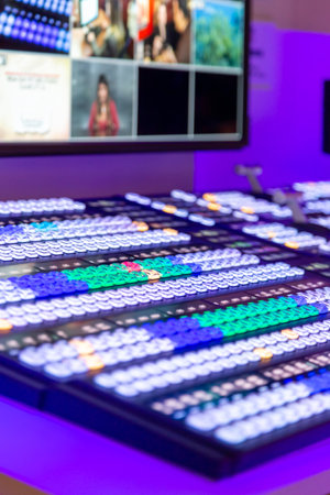 Video Mixer Switcher. Modern Live television broadcast video switcher production. Professional video and sound mixer control panel with buttons and sliders. Video switcher of Television Broadcastの写真素材