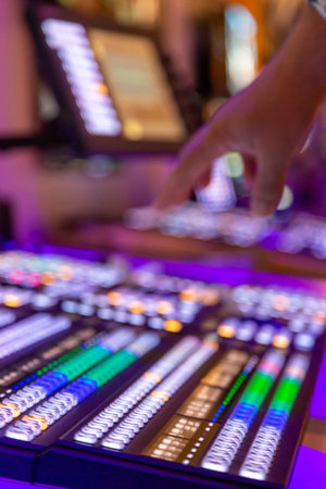 Switchboard for live broadcast production. Video mixer use. Video switch of Television Broadcast, working with video and audio mixer, control broadcasts in recording studio. Mix board, selective focusの写真素材