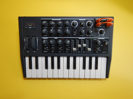 Analog Synthesizer on yellow backgroundの写真素材