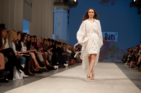 KIEV, UKRAINE - OCTOBER 14: Fashion model wears clothes created by "Olena Dats" at the Ukrainian Fashion Week on Oct. 14, 2011 in Kiev, Ukraine.のeditorial素材
