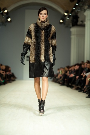 KIEV, UKRAINE - MARCH 14: Fashion model wears clothes created by 'Tetyana ZEMSKOVA & Olena VOROJBIT' at the Ukrainian Fashion Week on Mar. 14, 2012 in Kiev, Ukraine.のeditorial素材