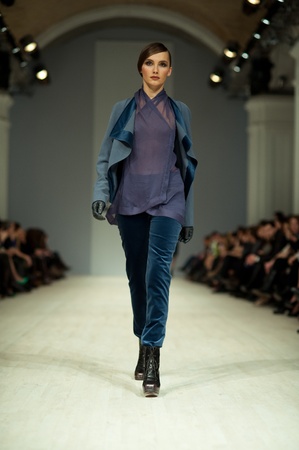 KIEV, UKRAINE - MARCH 14: Fashion model wears clothes created by 'Tetyana ZEMSKOVA & Olena VOROJBIT' at the Ukrainian Fashion Week on Mar. 14, 2012 in Kiev, Ukraine.のeditorial素材