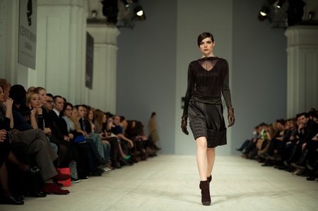 KIEV, UKRAINE - MARCH 14: Fashion model wears clothes created by 'Tetyana ZEMSKOVA & Olena VOROJBIT' at the Ukrainian Fashion Week on Mar. 14, 2012 in Kiev, Ukraine.のeditorial素材