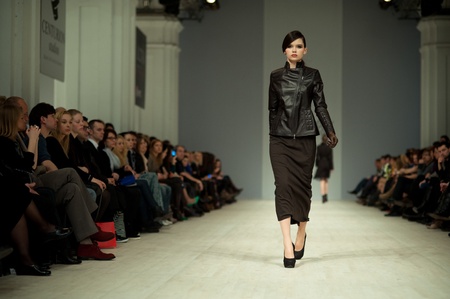 KIEV, UKRAINE - MARCH 14: Fashion model wears clothes created by 'Tetyana ZEMSKOVA & Olena VOROJBIT' at the Ukrainian Fashion Week on Mar. 14, 2012 in Kiev, Ukraine.のeditorial素材