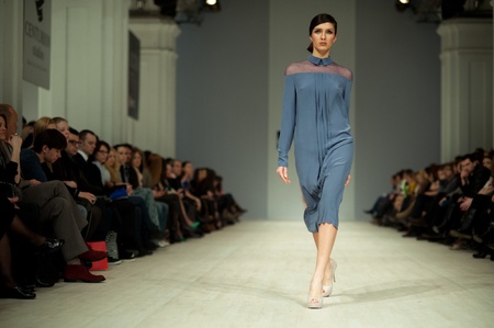 KIEV, UKRAINE - MARCH 14: Fashion model wears clothes created by 'Tetyana ZEMSKOVA & Olena VOROJBIT' at the Ukrainian Fashion Week on Mar. 14, 2012 in Kiev, Ukraine.のeditorial素材