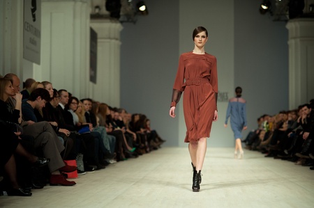 KIEV, UKRAINE - MARCH 14: Fashion model wears clothes created by 'Tetyana ZEMSKOVA & Olena VOROJBIT' at the Ukrainian Fashion Week on Mar. 14, 2012 in Kiev, Ukraine.のeditorial素材