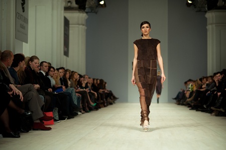 KIEV, UKRAINE - MARCH 14: Fashion model wears clothes created by 'Tetyana ZEMSKOVA & Olena VOROJBIT' at the Ukrainian Fashion Week on Mar. 14, 2012 in Kiev, Ukraine.のeditorial素材