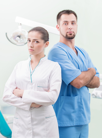 Portrait of a dentist and his assistantの写真素材