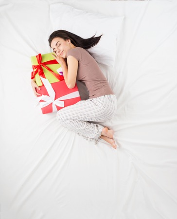 Top view photo of dreaming woman. Woman dreams about presents conceptの写真素材