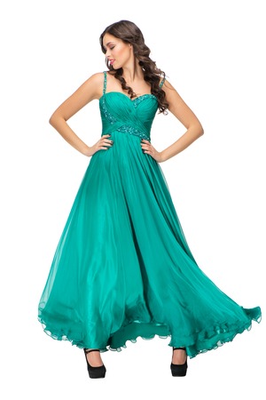 Woman in evening green dress. Pretty sexy brunette fashion model girl in her 20sの写真素材
