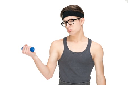 Funny sporty nerd in glasses and dumbbell isolated on white backgroundの写真素材