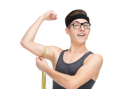 Funny sporty nerd in glasses and measuring tape isolated on white backgroundの写真素材