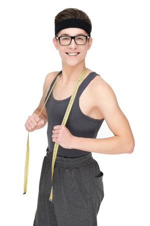 Funny sporty nerd in glasses and measuring tape isolated on white backgroundの写真素材