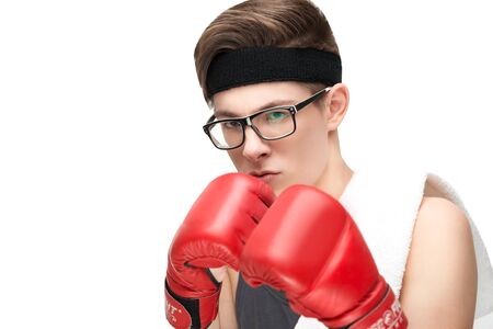 Funny sporty nerd in glasses and box gloves isolated on white backgroundの写真素材