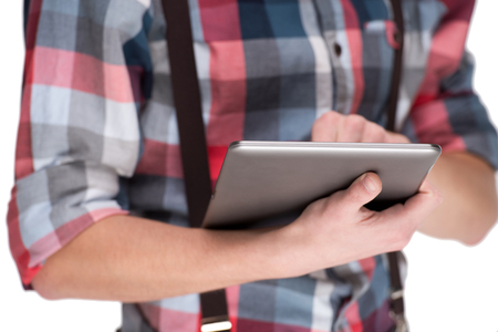 Young male hands in checkered shirt with digital tablet pc isolated on white backgroundの写真素材