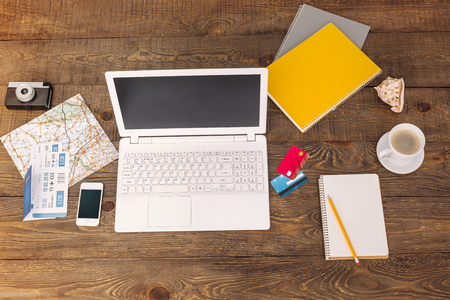 Business objects. Top view creative photo of objects on vintage brown wooden table.の写真素材