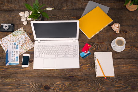 Business objects. Top view creative photo of objects on vintage brown wooden table.の写真素材