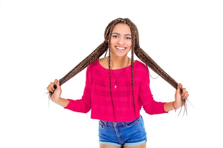 Funny picture of african young woman. Girl with African braids looking at camera and cheerfully...