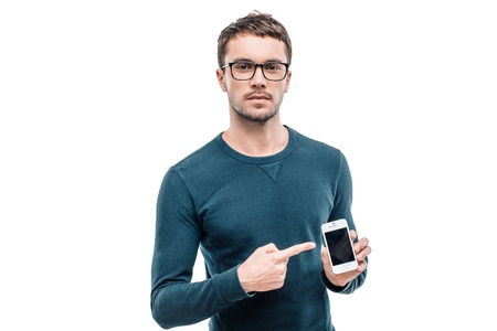 Portrait of stylish handsome young man isolated on white background. Man wearing glasses, looking at...