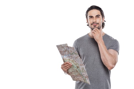 Portrait of stylish handsome young man isolated on white background. Man holding mapの写真素材