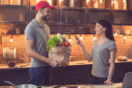 Man with food from food delivery serviceの写真素材