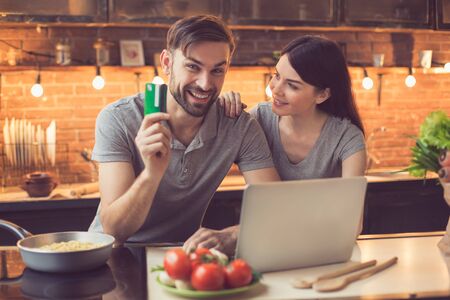 Young couple ordering food onlineの写真素材