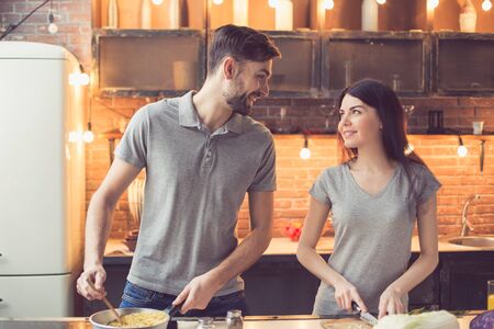 Young couple cooking in kitchenの写真素材