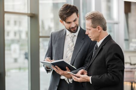 Stylish businessmen working in office
