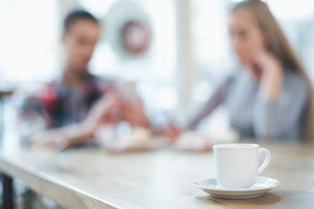 Nice looking man and woman in cafeの写真素材