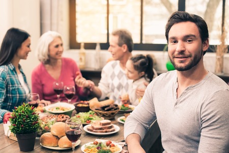 Nice family having tasty dinnerの写真素材