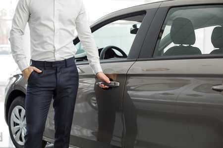 Young Man in a Car Rental Service Test Drive Conceptの写真素材