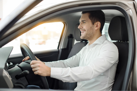 Young Man in a Car Rental Service Test Drive Conceptの写真素材