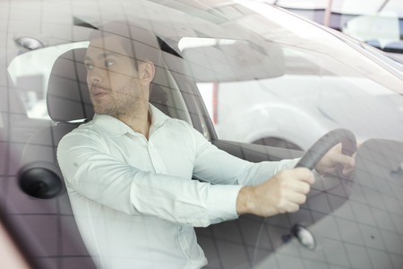 Young Man in a Car Rental Service Test Drive Conceptの写真素材