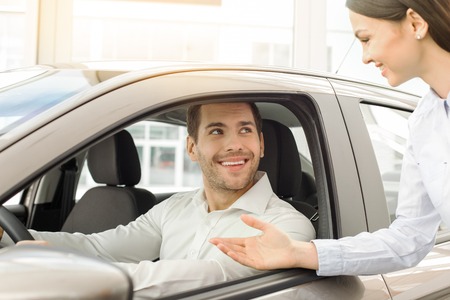 Young Man in a Car Rental Service Test Drive Conceptの写真素材