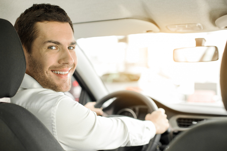 Young Man in a Car Rental Service Test Drive Conceptの写真素材