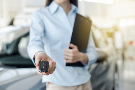 Young Woman in a Car Rental Service Assistant Conceptの写真素材