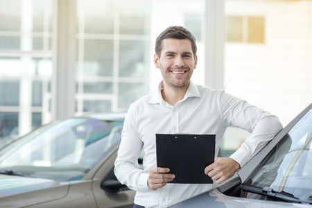 Young Man in a Car Rental Service Transportation Conceptの写真素材