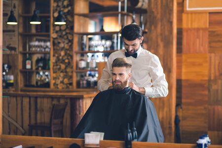 Young Man in Barbershop Hair Care Service Concept