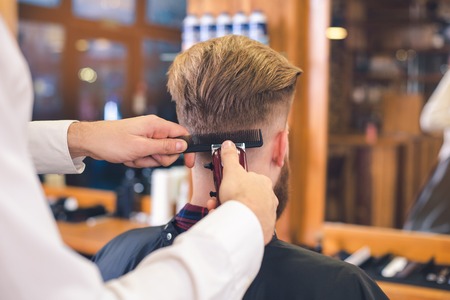 Young Man in Barbershop Hair Care Service Conceptの写真素材