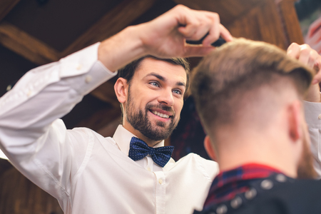 Young Man in Barber Shop Hair Care Service Conceptの写真素材