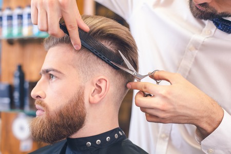 Young Man in Barber Shop Hair Care Service Conceptの写真素材
