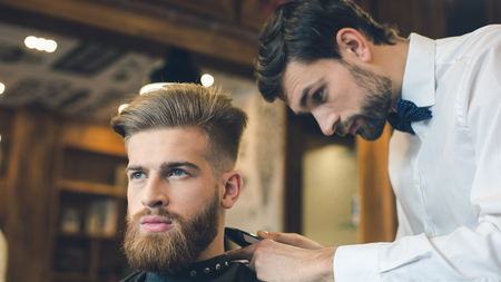 Young Man in Barbershop Hair Care Service Conceptの写真素材